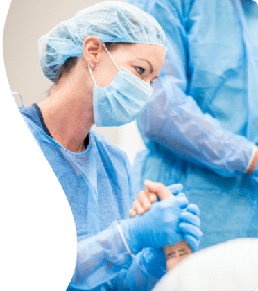 Photo-1-1 A female surgeon wearing a mask and gloves